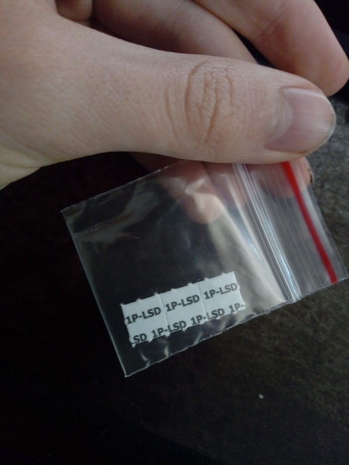 1P-LSD blotter papers, as identified by the photographer.